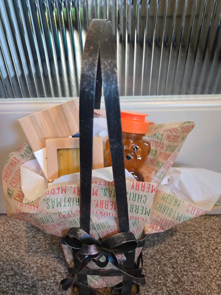Holiday Gift Basket with green ribbon, honey, and handmade soap